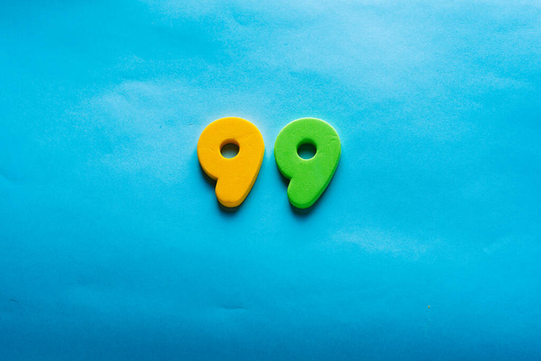 Number on a bright blue background. - 写真・画像