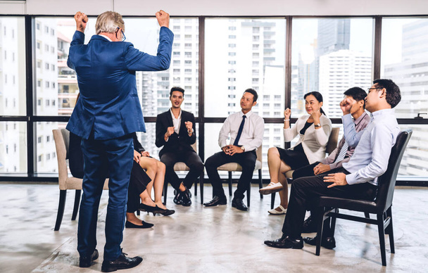 Businessman standing in front of group of people in consulting meeting conference seminar at hall or seminar room.presentation and coaching concept - Photo, Image