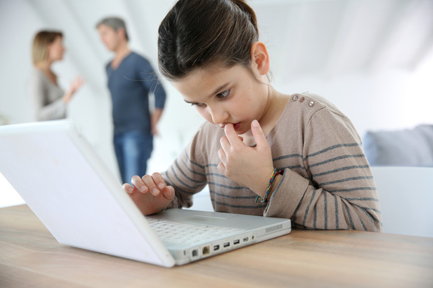 Girl doing homework on laptop - Foto, immagini