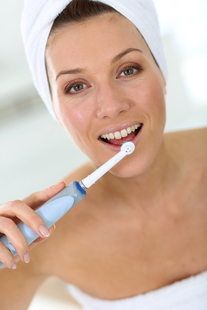 Woman brushing her teeth - Photo, image