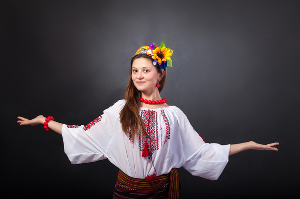 Attractive woman wears Ukrainian national dress - 写真・画像