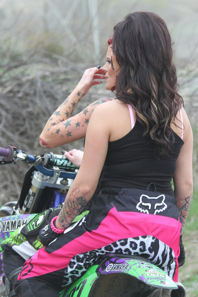 Two beautiful brunette biker girls on the bike - Фото, зображення