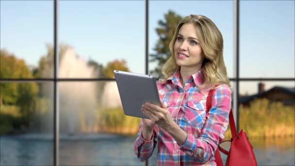 Attractive young woman using digital tablet. - Footage, Video