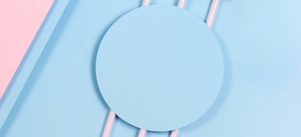 Abstract pastel background. Mockup of blue paper card on pastel blue and pink background. Minimal geometric shapes and lines, top view - 写真・画像