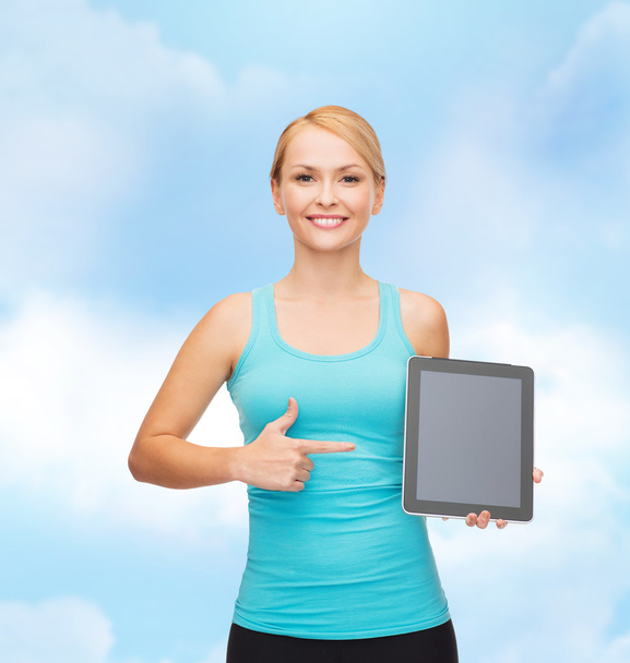 Sporty woman with tablet pc blank screen - Фото, изображение