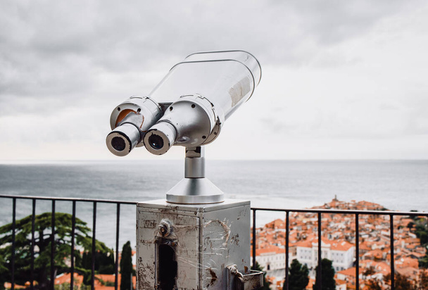 Tourist binoculars watch city and sea. View from tower. Travel, vacation, sightseeing, tourism. Piran, Slovenia, Europe. - Photo, Image