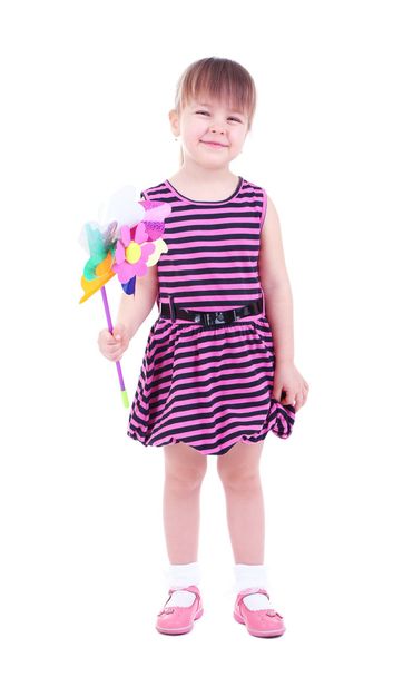 Beautiful little girl holding colorful windmill isolated on white - Photo, Image