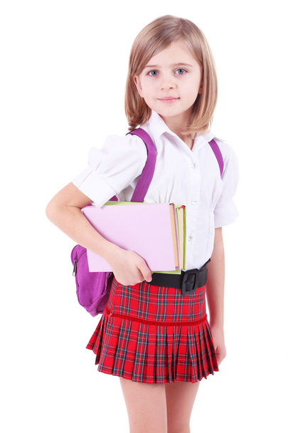 Beautiful little girl with backpack holding books isolated on white - Φωτογραφία, εικόνα
