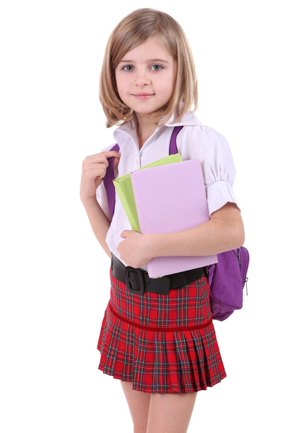 Beautiful little girl with backpack holding books isolated on white - Fotoğraf, Görsel