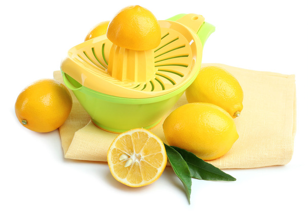 Citrus press and lemons isolated on white - Foto, immagini