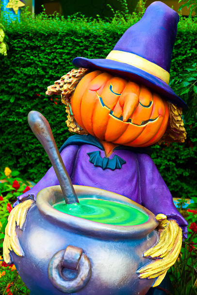 Cute Halloween witch statue made of pumpkins.Halloween seasons.Jack o lantern - Photo, Image