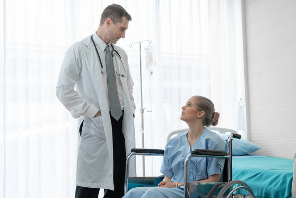 Doctor in professional uniform examining patient at hospital - Foto, immagini