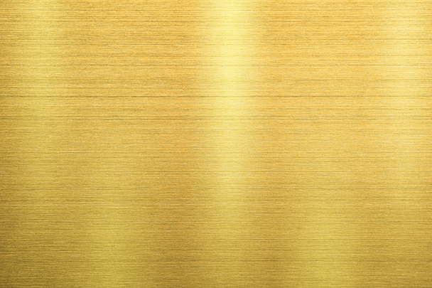 Texture métallique dorée de la plaque d'acier inoxydable brossé avec réflexion de la lumière. - Photo, image