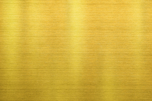 Tekstura złotego tła ze stali nierdzewnej lub złotej linii polerowanego metalu z odbiciem światła. - Zdjęcie, obraz