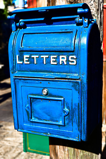 Antique Blue Letter Box on the Telegraph made of wood.Vintage metal mail box.Front view of Very Old (Vintage) big blue US Postal mail box.  - Photo, Image
