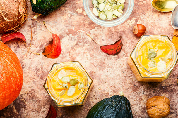 Healthy pumpkin smoothie in glass jars.Traditional autumn dishes - Zdjęcie, obraz