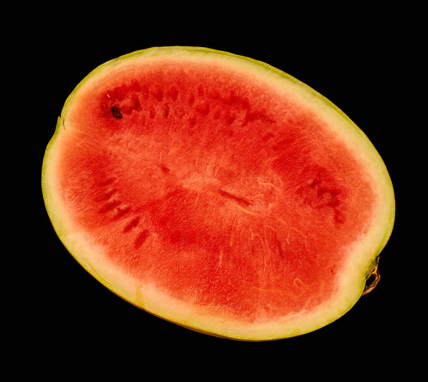 red watermelon lies on the kitchen table                                - Fotografie, Obrázek