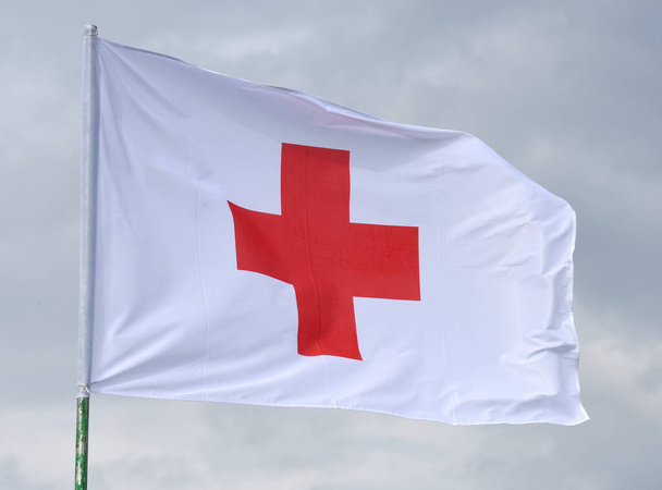 Starytchi, Ukraine - September 24, 2020. Flag of the Red Cross - the International Movement of the Red Cross are international humanitarian organizations.  - Fotó, kép