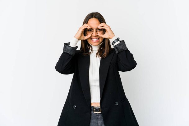 Young mixed race business woman isolated on white background showing okay sign over eyes - Φωτογραφία, εικόνα