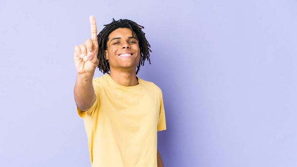 Young african american rasta man showing number one with finger. - Photo, image