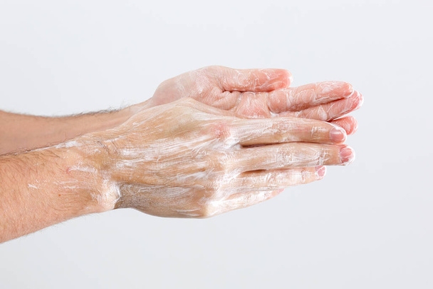 Close up image of washing hand against white background - Photo, Image