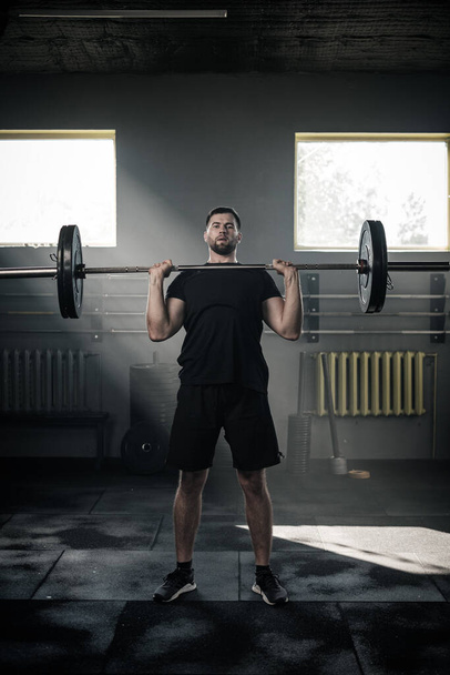 Athletic Man Lift Heavy Barbell . - Photo, image