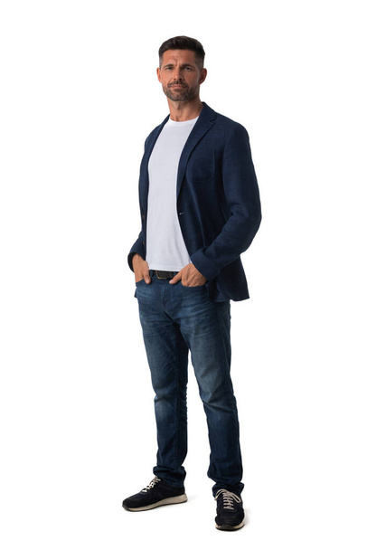 Full length portrait of mid adult serious business man in jeans and blue blazer isolated on white background, casual people - Fotoğraf, Görsel
