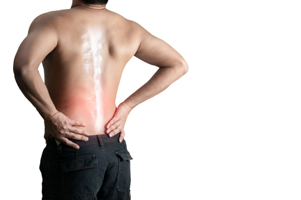 Giovane uomo che trattiene il mal di schiena spina dorsale su uno sfondo bianco - Foto, immagini
