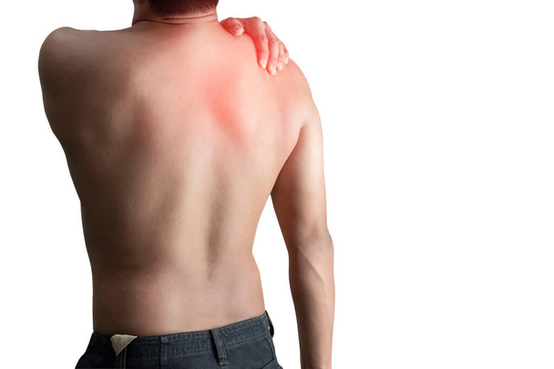 Junger Mann mit Rückenschmerzen auf weißem Hintergrund - Foto, Bild