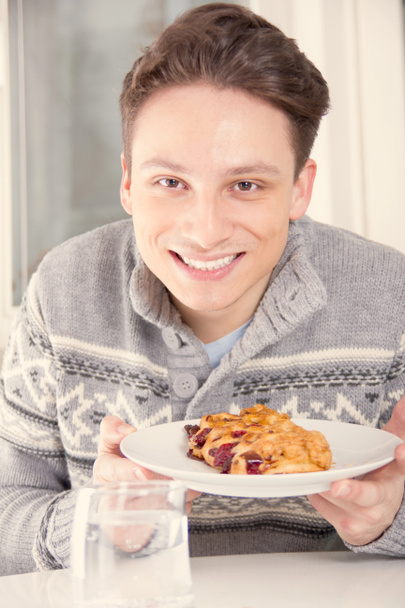man holding dessert on the plate - Photo, Image