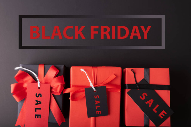 Black Friday sale concept. Red Sale tag  and Black Sale tag color on the black background with Copy space. Black Friday weekend - Фото, зображення