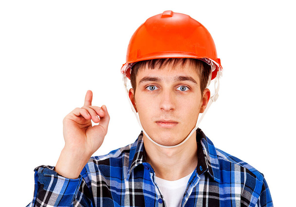 Young Man in Hard Hat with Finger Up Isolated on the White Background - 写真・画像