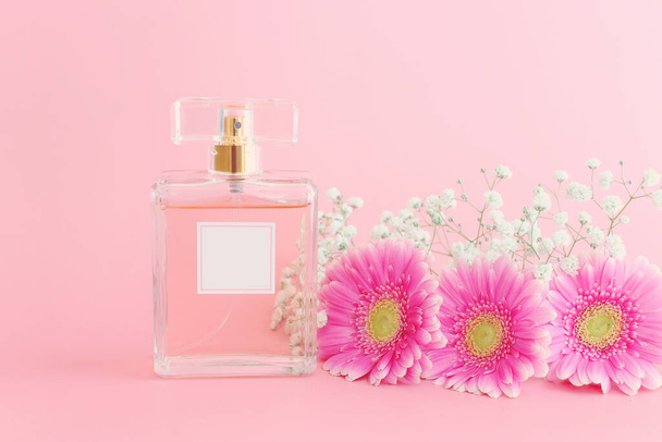 Image of elegant perfume bottle over pink pastel background - Zdjęcie, obraz
