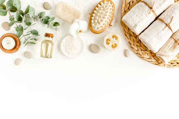 Spa Background. Natural, Organic spa cosmetics products, eco friendly bathroom accessories, eucalyptus leaves. Skincare concept on white background.  - 写真・画像