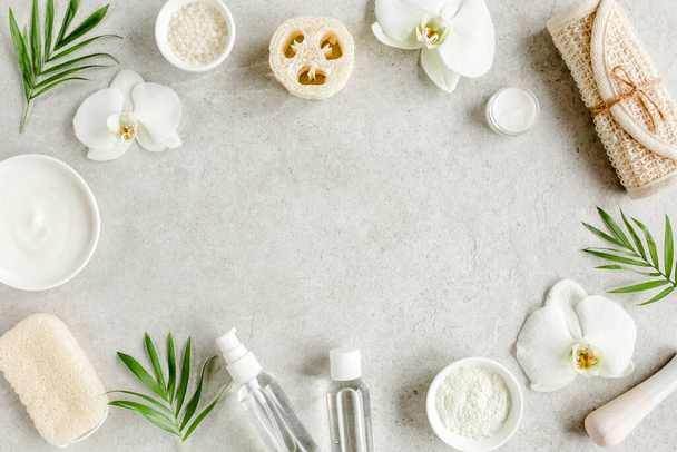 Spa treatment concept. Natural,Organic spa cosmetics products, sea salt, massage brush. Spa background with a space for a text, flat lay, top  - Zdjęcie, obraz