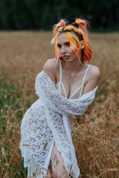 girl with colored hair in underwear in a wheat field - Foto, immagini
