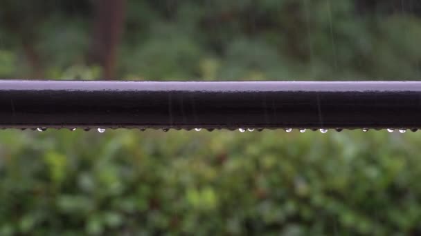 raindrops fall to the balcony railing and slide down during heavy thunderstorm - Footage, Video
