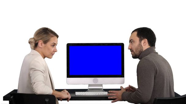 Business people having meeting around monitor of computer talkin - 写真・画像