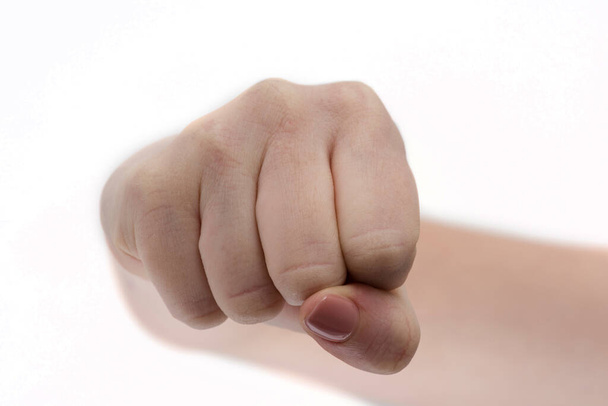 Fist. Girl fists clenched in anger. Womans hands with fist gesture front side Isolated on white background. Hand gesture. Woman clenched fist ready to punch close-up. Self defense. Martial art boxing - Photo, Image