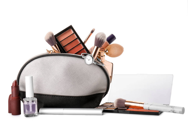 Makeup bag with decorative cosmetics and accessories on white background - Foto, Imagen