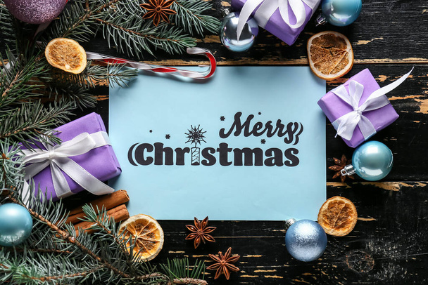 Beautiful greeting card for Christmas celebration on dark wooden background - Fotoğraf, Görsel
