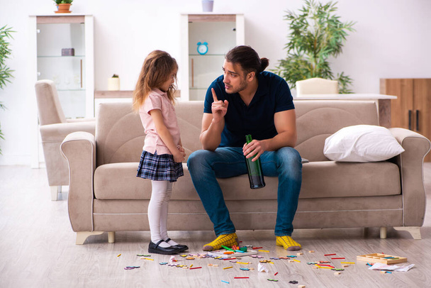Drunk father and little girl indoors - Photo, Image