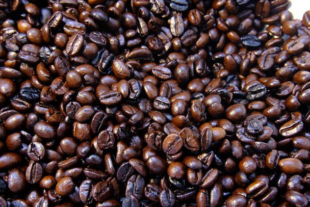 Nahaufnahme geröstete Kaffeebohnen Hintergrund und Textur - Foto, Bild