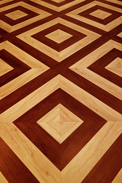 Vertical image of brown and beige geometric pattern wooden floor - Photo, Image