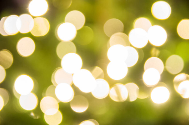 yellowChristmas lights in defocus; christmas background - Photo, Image
