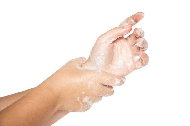 Vrouwenhanden geïsoleerd op witte achtergrond. Handen wassen met zeepbellen. - Foto, afbeelding