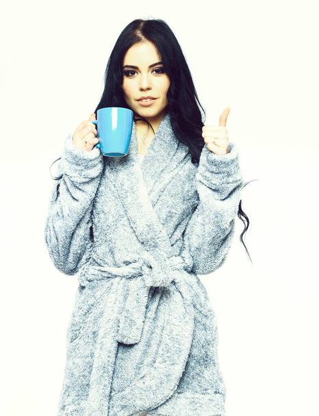 sexy girl posing in blue velour bathrobe with cup - Фото, изображение