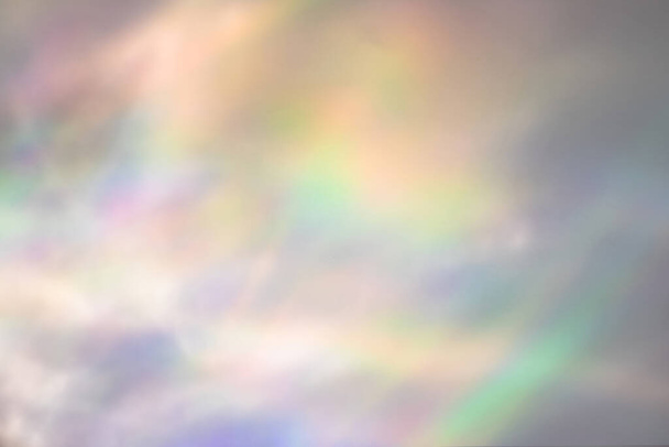 Blurred rainbow light refraction texture on white wall - Photo, Image