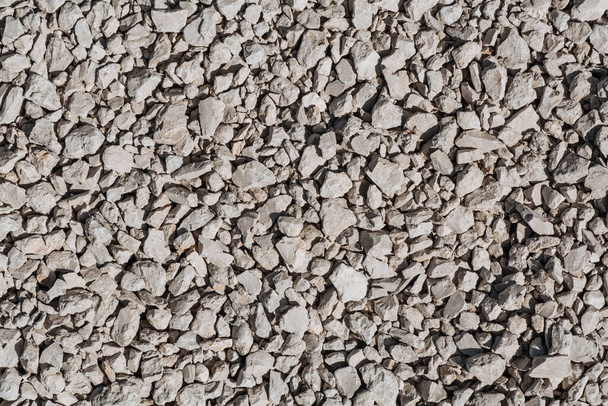 Background of gray crushed stone different forms. - Photo, Image