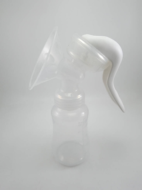 Clear plastic silicone breast pump use for lactating mother - Photo, Image